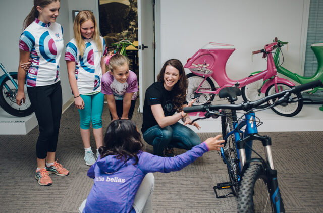 Sabra Davison grew up ski racing and running, but when she got into mountain biking, she saw girls participating at far lower rates — so she decided to do something about it. Sabra (along with her sister, World Cup XC racer and two-time Olympian, Lea) founded Little Bellas to get girls into riding bikes, and develop the confidence to keep with it. On the latest episode of Bikes and Big Ideas, we sat down with Sabra to talk about Little Bellas; how to make skill building fun; removing barriers to participation in what is an expensive sport; and a whole lot more.