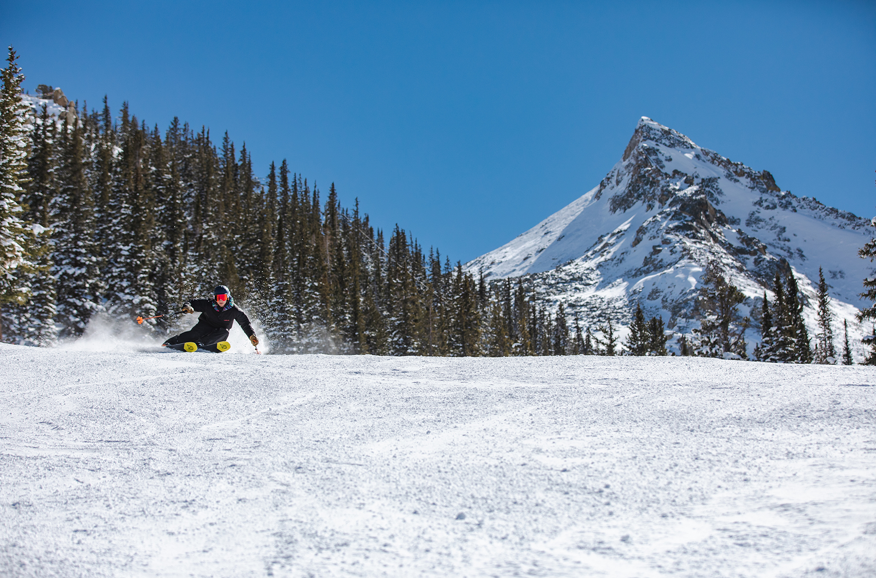 WNDR Alpine's Ethan proving fat reverse-cambered skis can definitely carve.