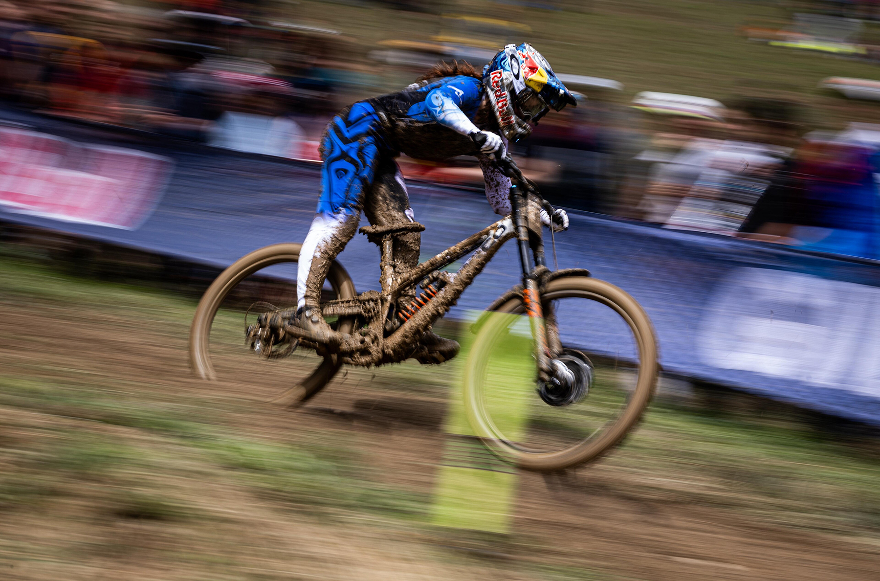 Gracey Hemstreet caked in mud on her way to winning in at the Les Gets World Cu